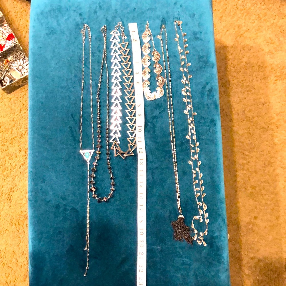 Assorted silver necklaces